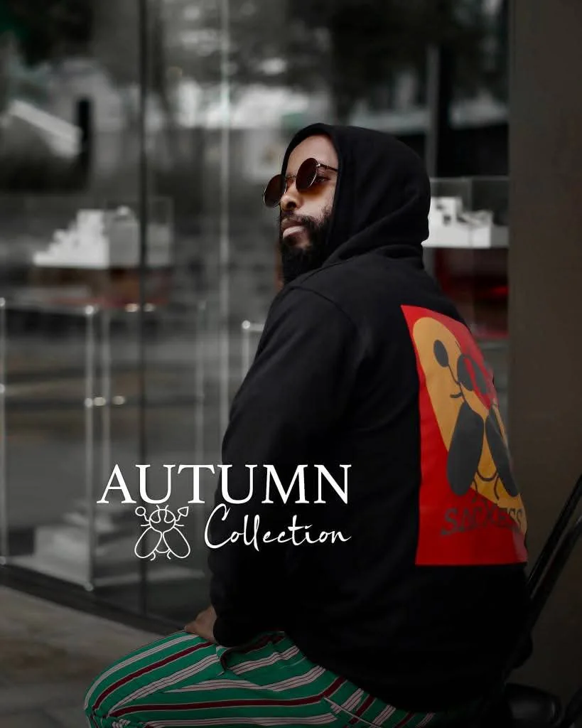 Archive campaign image: a man in a black SACXESS hoodie, with the original Autumn Collection title